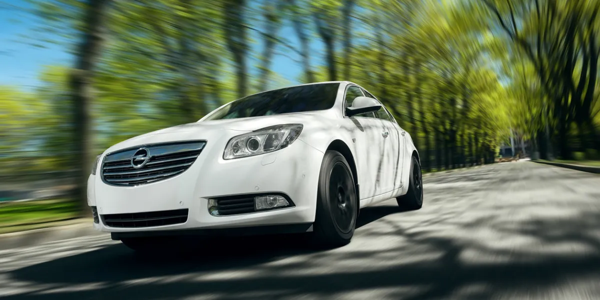 moscow, russia - may 07, 2015  car opel insignia drive at asphalt forest road at daytime