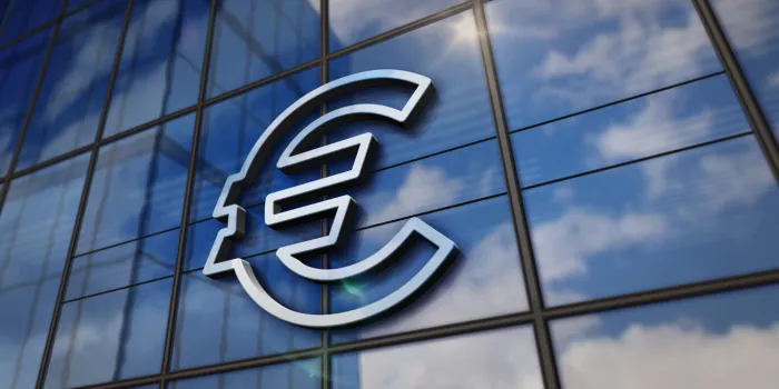 euro eu currency symbol on glass building mirrored sky and city on modern facade finance,european union, banking and money sign concept 3d rendering illustration