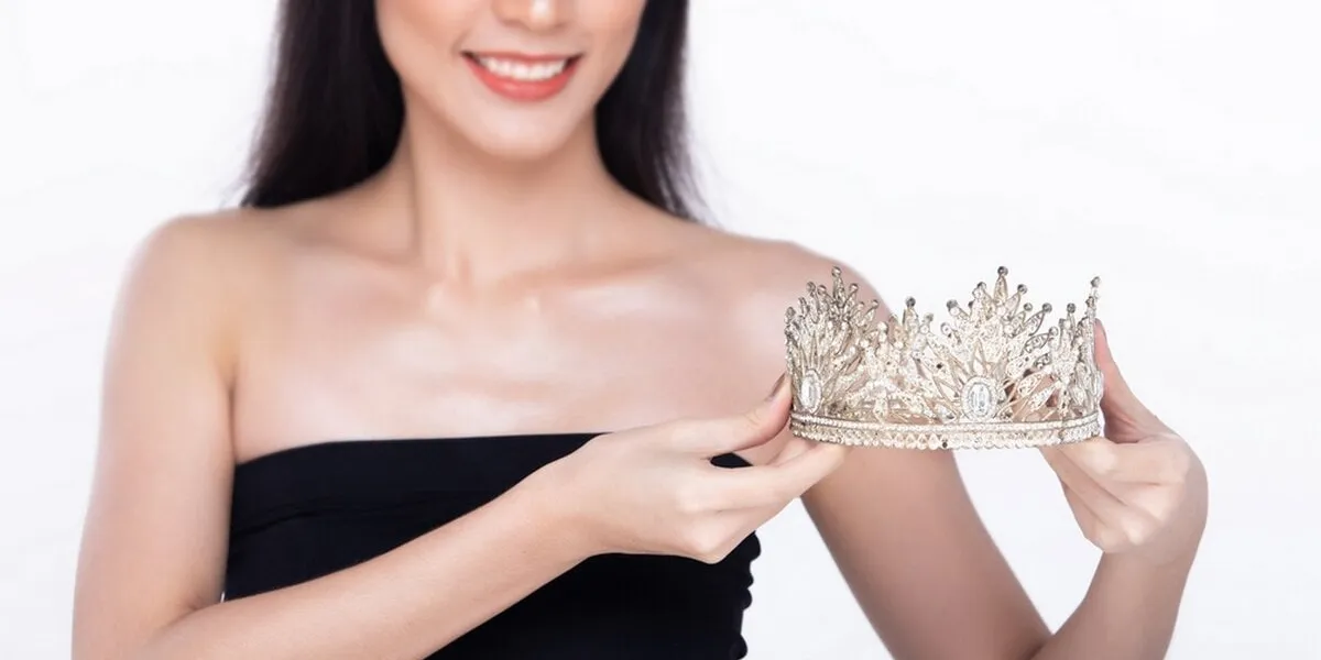 beautiful fresh skin women hold diamond miss beauty pageant contest crown and long black hair portrait young girls in attractive natural fashion face express feel smile, isolated white background
