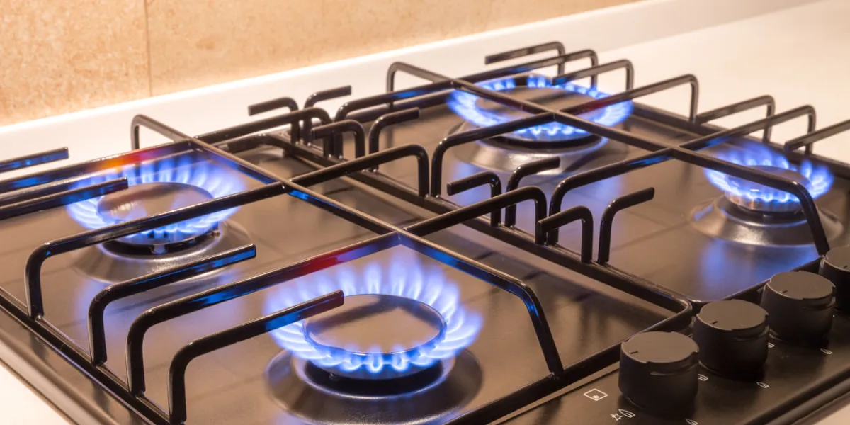 gas burner on a black modern kitchen stove