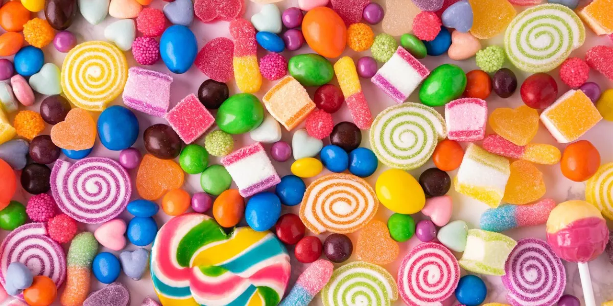lollipops candies and sweet sugar jelly multicolored, colorful sweets top view and close up background