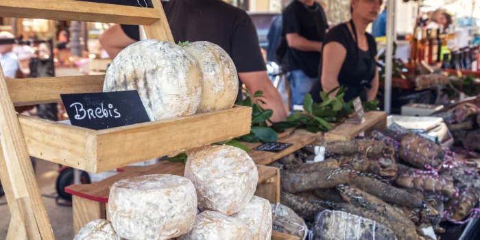 l'ile rousse, corsica - 30th september 2018 locally made cheeses and cured meats are displayed for sale at an artisan fair in l'ile rousse in the balagne region of corsica