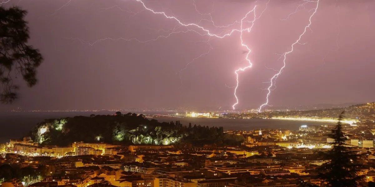 a picture taken on october 23, 2019 shows lightning flashing through the sky over the french riviera city of nice, southeastern france (photo by valery hache   afp)