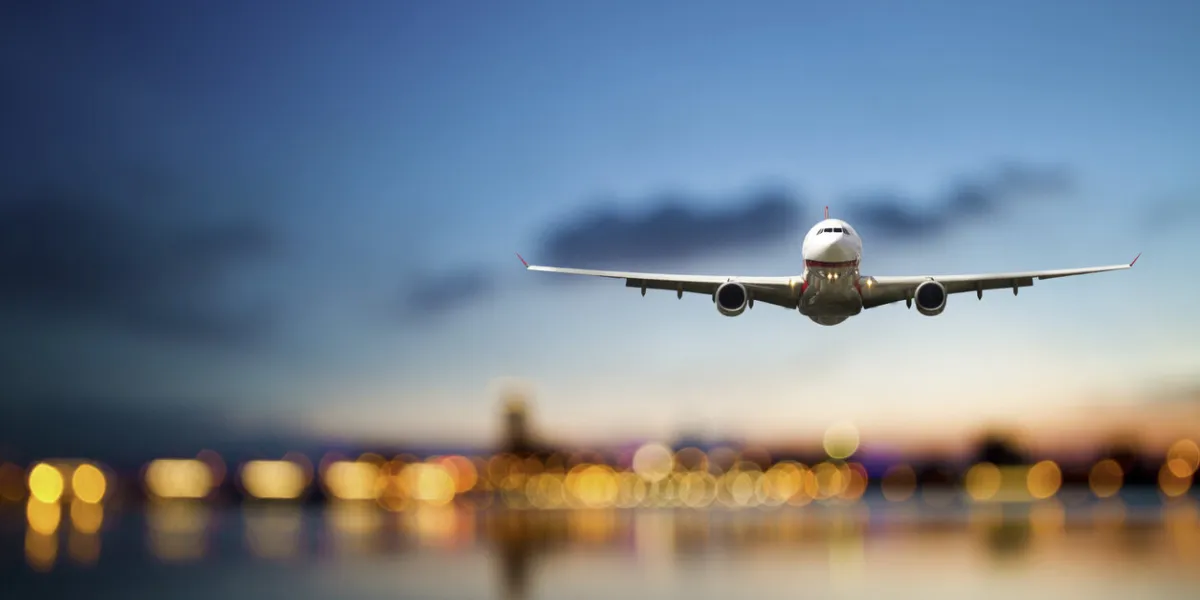 perspective view of jet airliner in flight with bokeh background