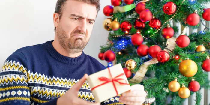 man feeling angry and disappointed about wrong christmas gift