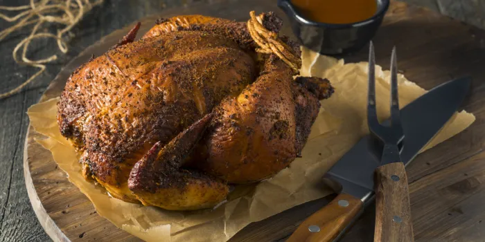 homemade barbecue smoked chicken ready to carve