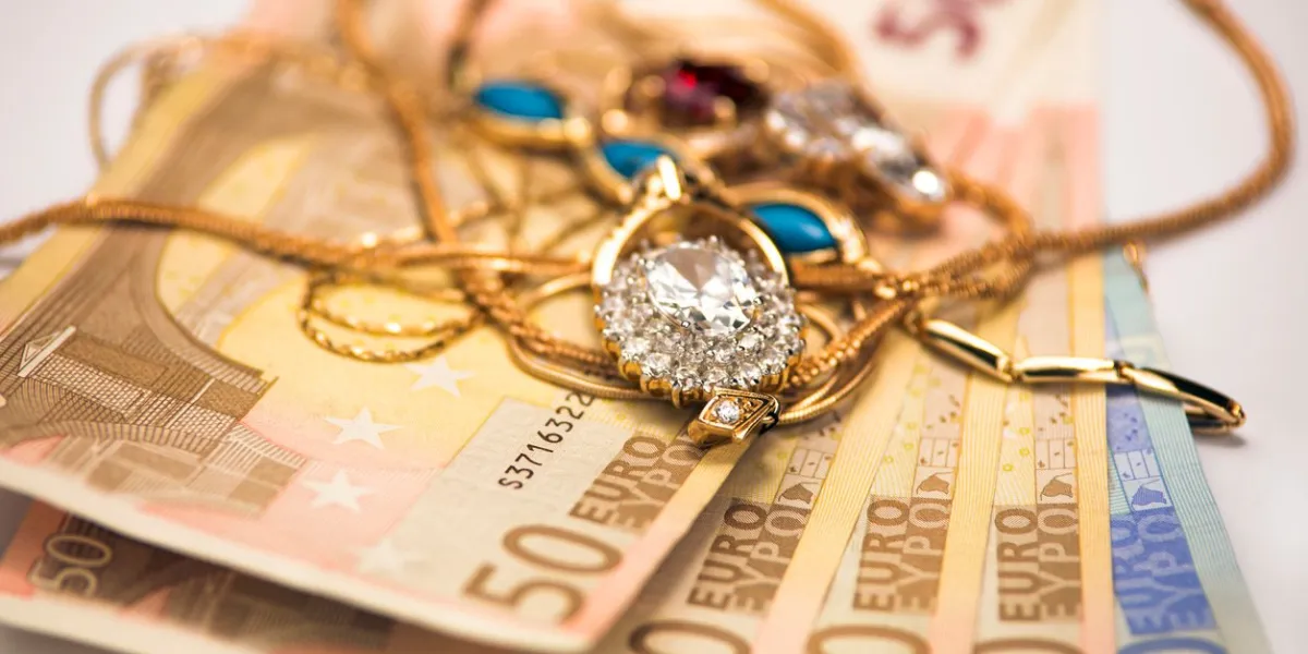 jewelry and money on a white background