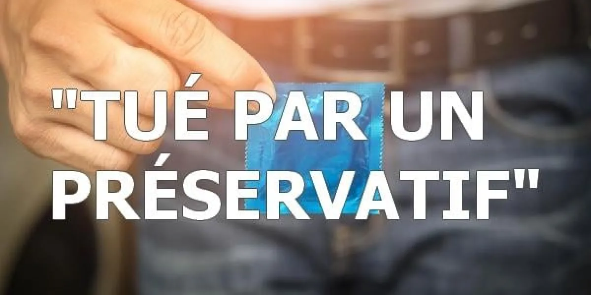 man in white shirt holding condom in hand