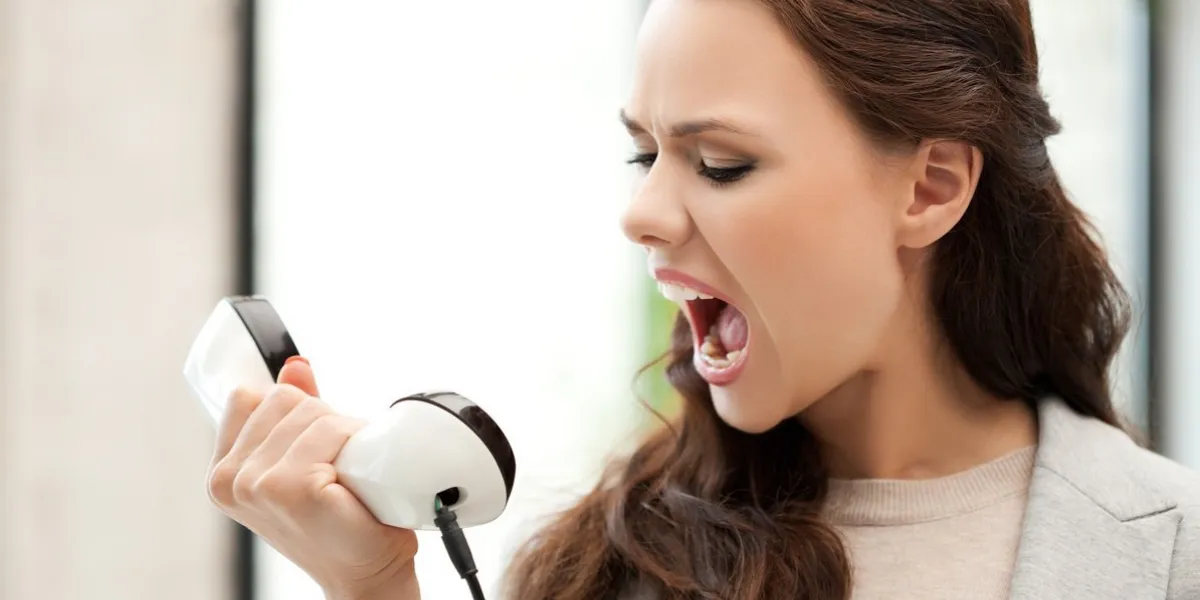 picture of angry businesswoman shouting at phone
