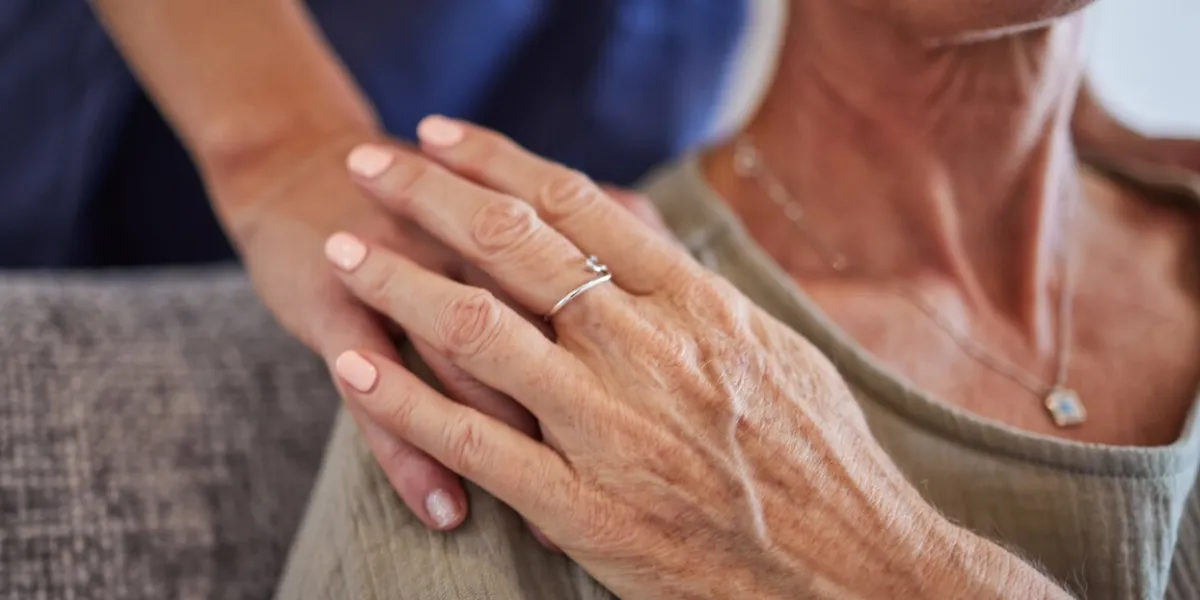 senior, hands and care for love, support in mature health and generations indoors at home hand of a elderly lady holding caregiver in trust, comfort and reliable gentle embrace and respect for elder