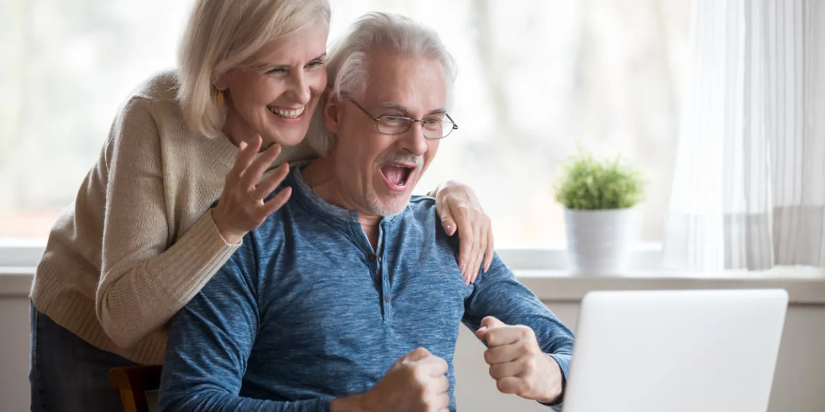 happy aged spouses looking on pc screen feels happy received unbelievable great news, enjoying celebrating win online lottery senior positive wife husband founding out about sale and huge discounts