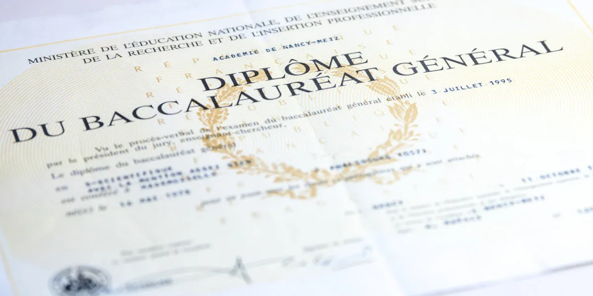 paris, france -march, 26, 2020- baccalaureate certificate and keyboard in france