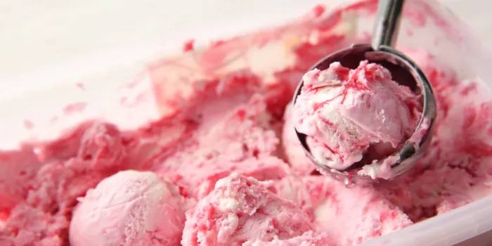tasty strawberry ice-cream with scoop, closeup