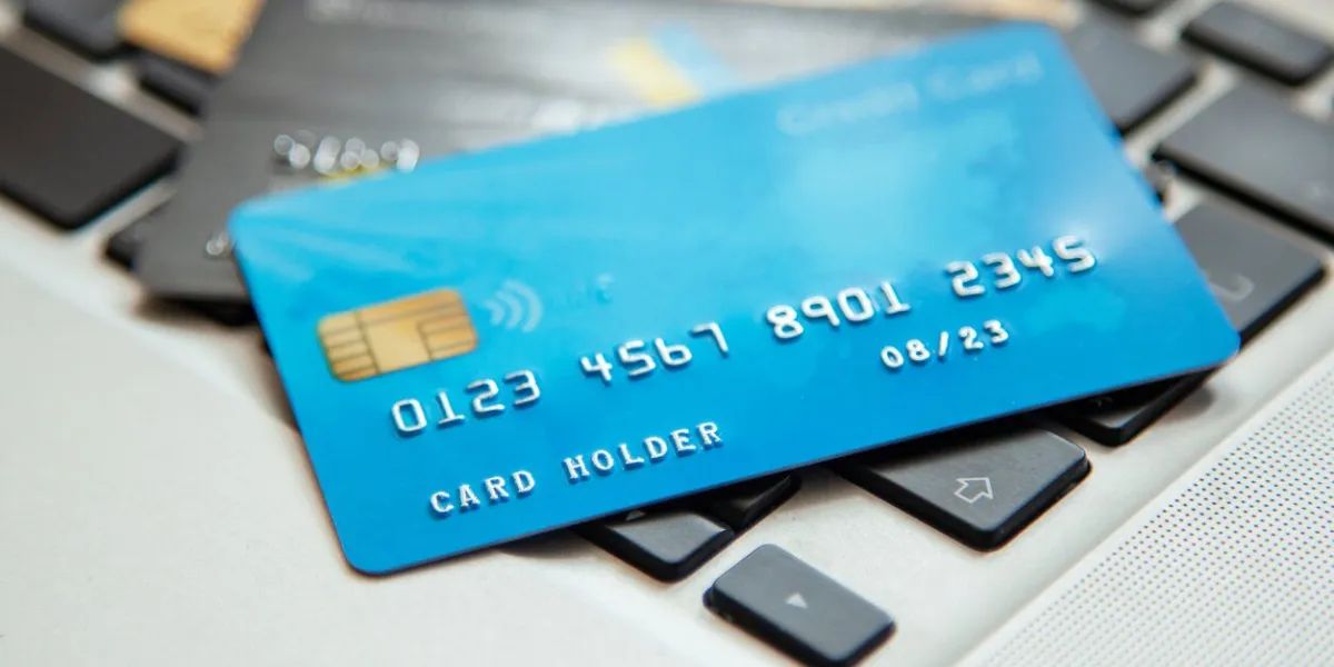 pile of credit cards on the laptop keyboard open access for online shopping