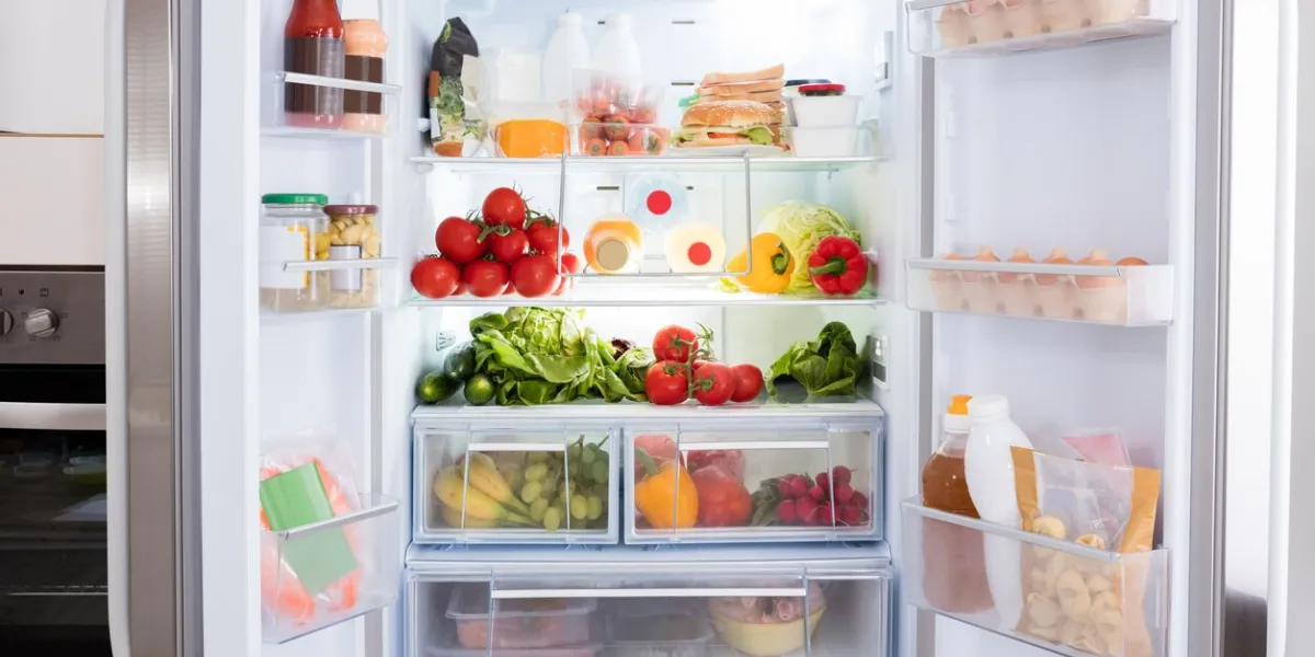 open refrigerator filled with fresh fruits and vegetable