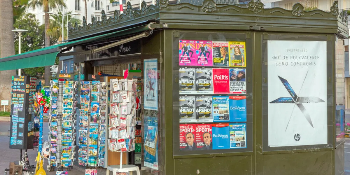 cannes, france - february 1, 2016  newspapers kiosk at promenade de la croisette in cannes, france