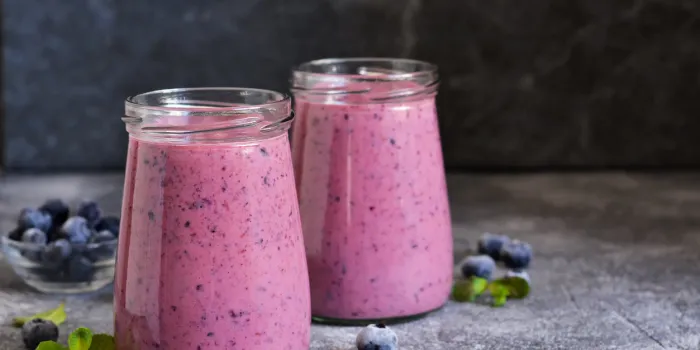 purple smoothies with blueberries on the kitchen table detox menu