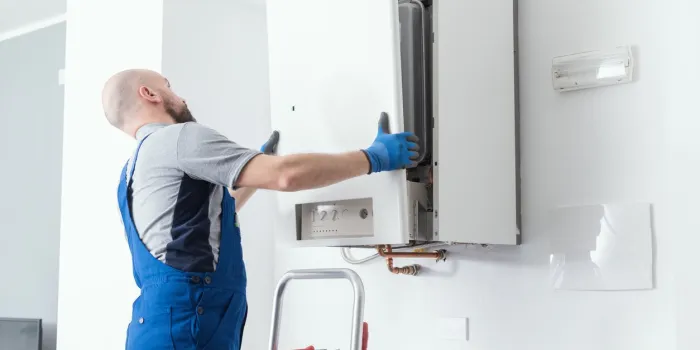 professional engineer doing a boiler inspection at home