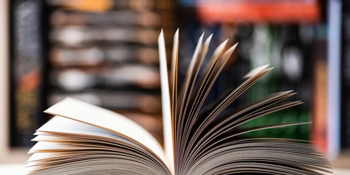 open book close up photo, blurred background