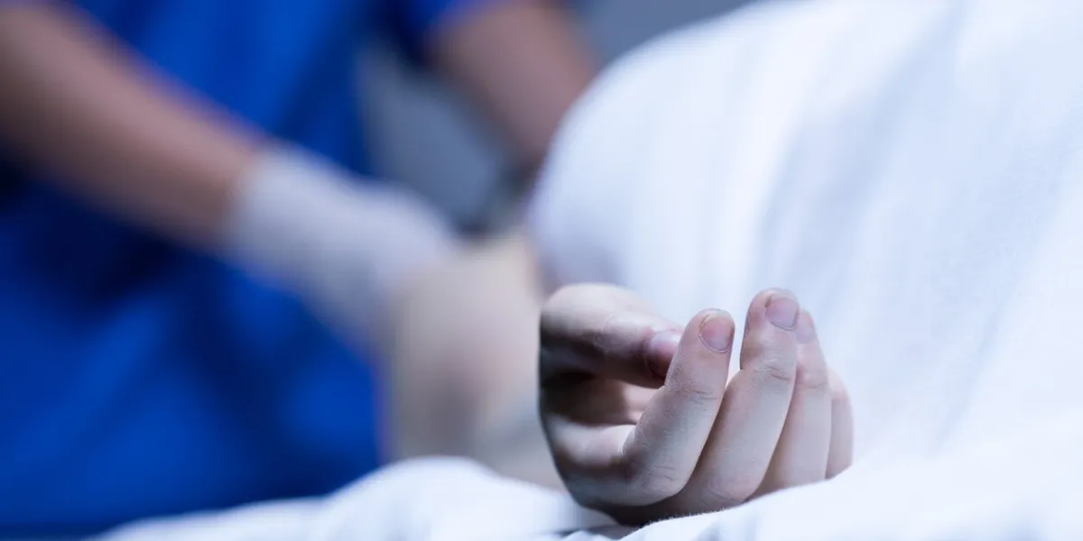 closeup of lurid hand of dead body