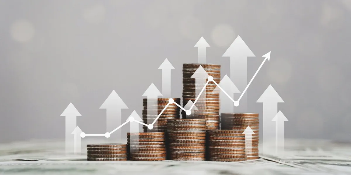 stack of silver coins with trading chart in financial concepts and financial investment business stock growth