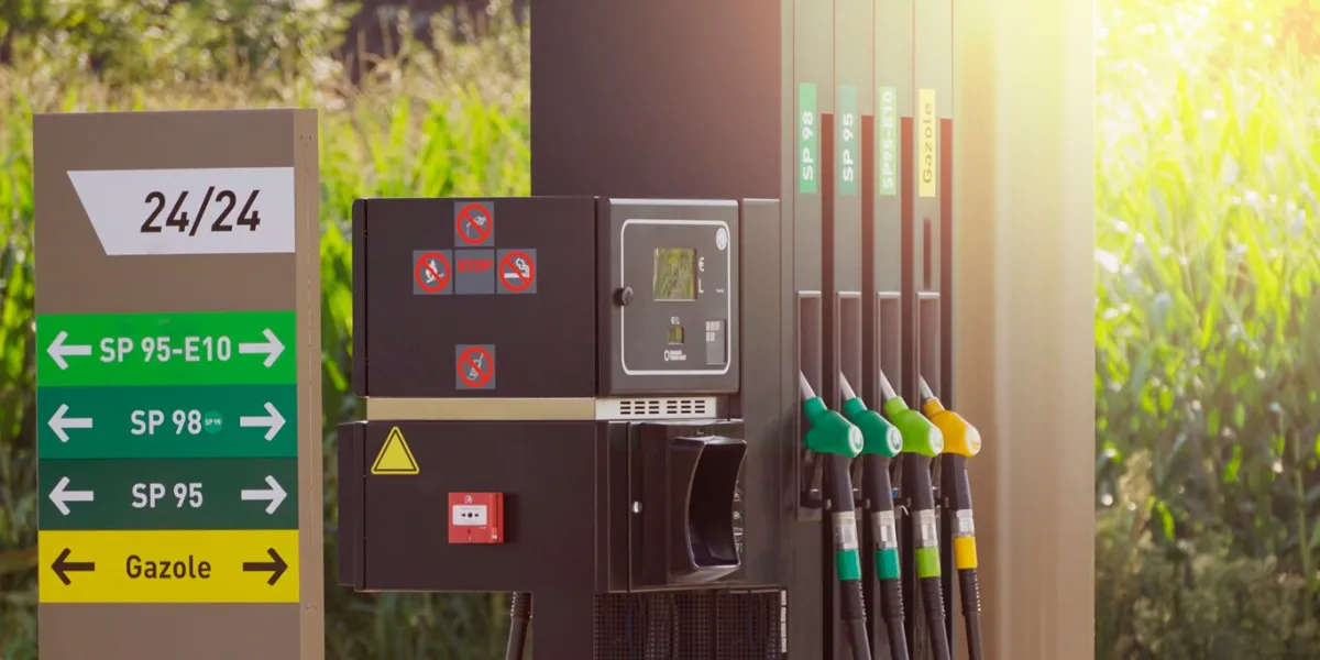 fuel pumps at a gas station, informations signs fuel nozzle in oil dispenser petrol gun filling green and golden colors