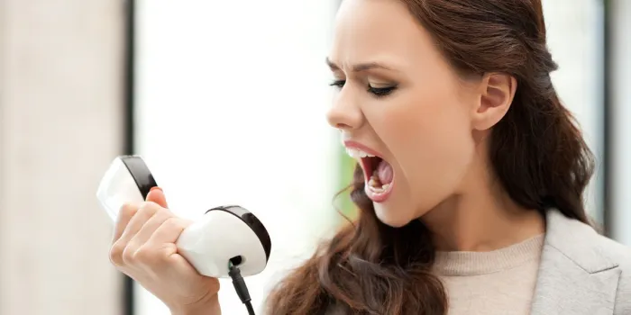 picture of angry businesswoman shouting at phone
