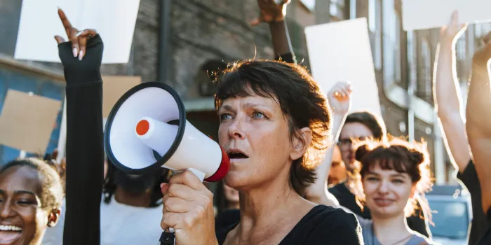 feminist with a megaphone at a protest