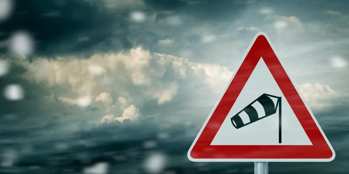 storm clouds with warning sign