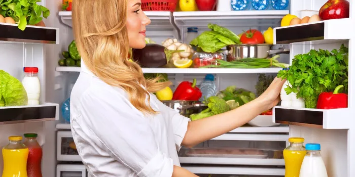happy female search something in the fridge, fresh fruits and vegetables in the refrigerator, cooking diet food, fit and body care concept