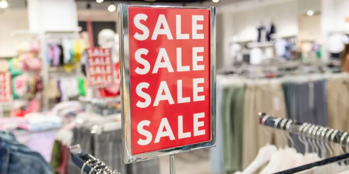 sign with the word sale in a clothing store selective focus