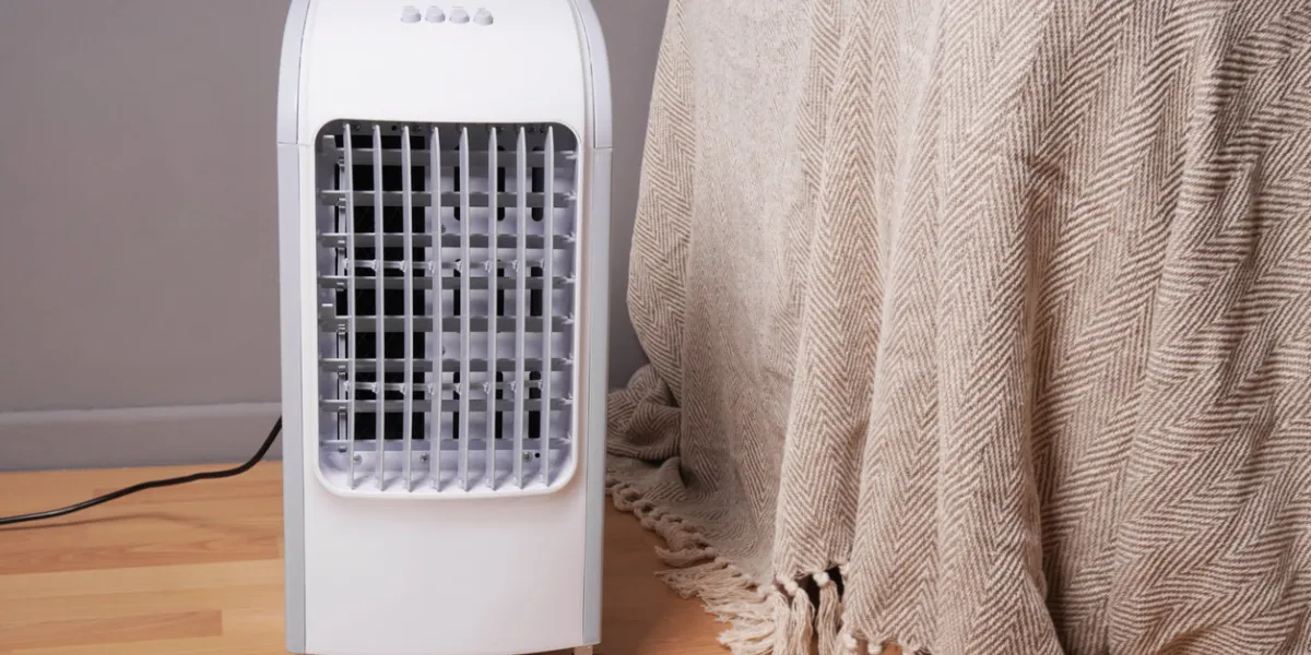 portable air cooler and humidifier on casters in domestic living room to improve indoor clmate
