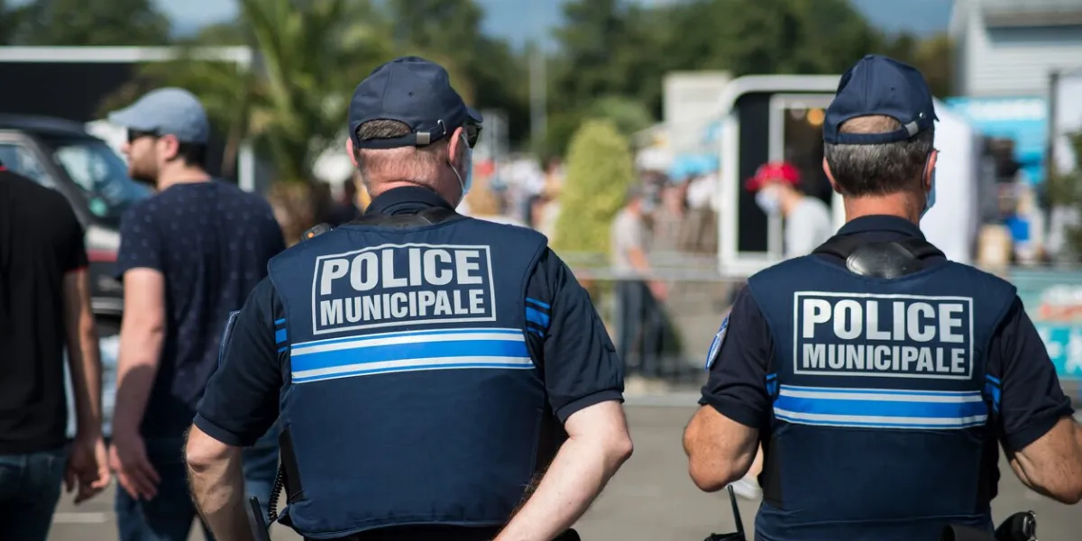 mulhouse - france - 13 september 2020 - portrait on back view of municipal policemen patrolling in the street during the covid-19 pandemic