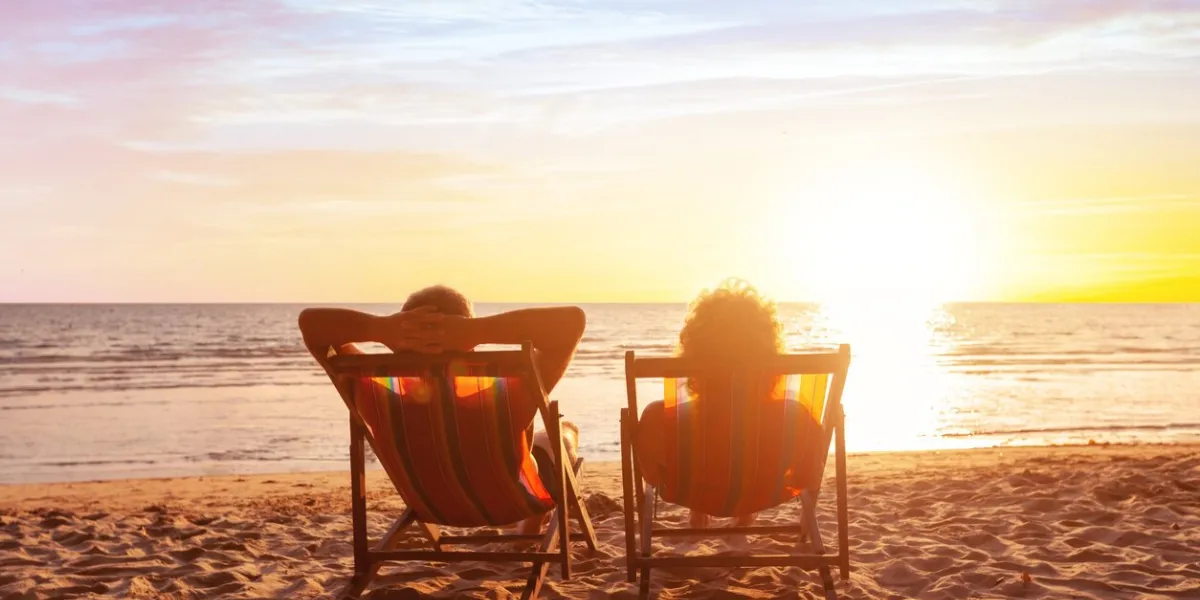 summer holidays, beach travel, vacation for couple, man and woman relax and enjoy life together at sunset