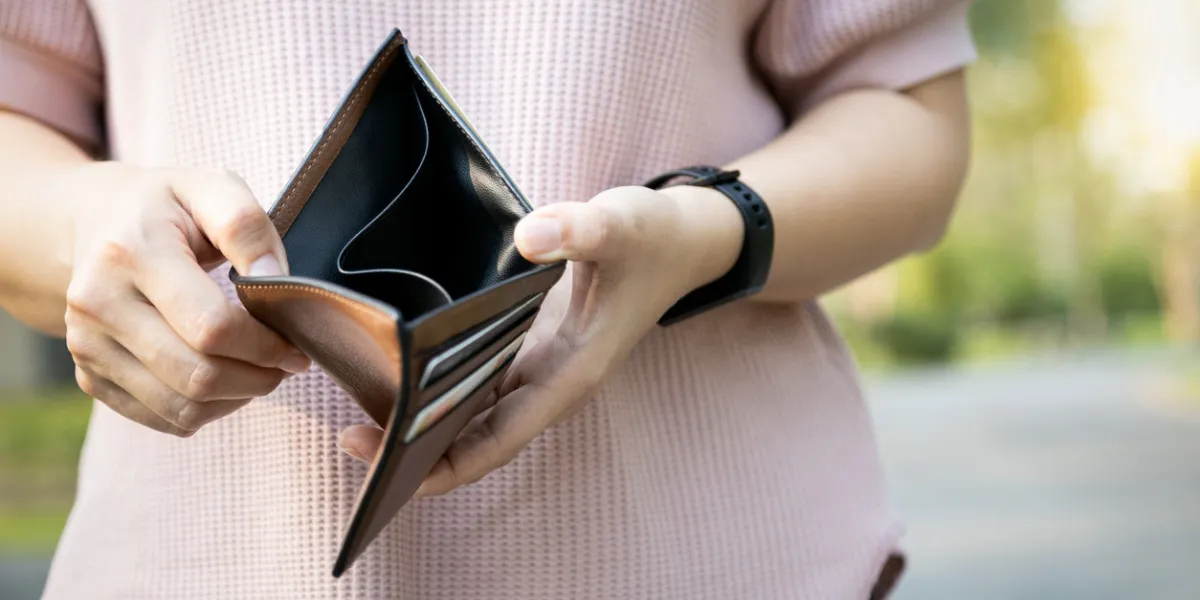 hand of bankrupt girl holding a wallet,hand open an empty wallet,no cash,financial problem,economic depression,effects of the covid-19, asian woman shows her empty money in wallet,unemployment concept