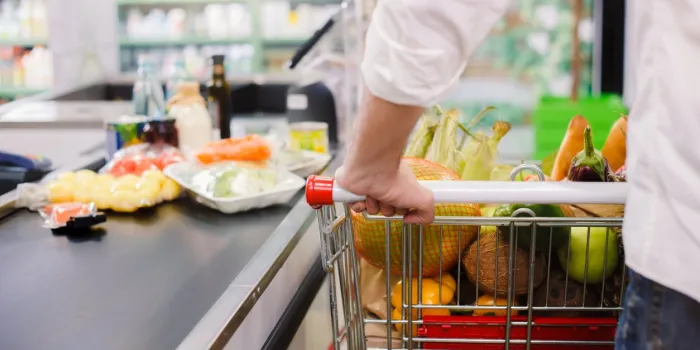 man buying food products in the supermarket shopping