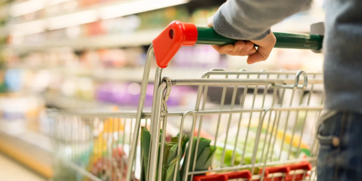 close-up detail of a man shopping in a supermarket