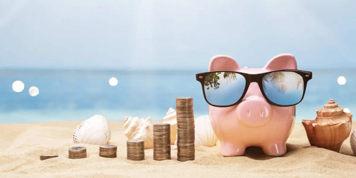 pink piggy bank near growing coin stacks