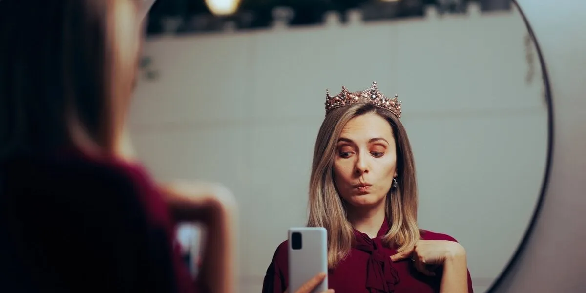 funny egocentric lady taking selfish in the mirror