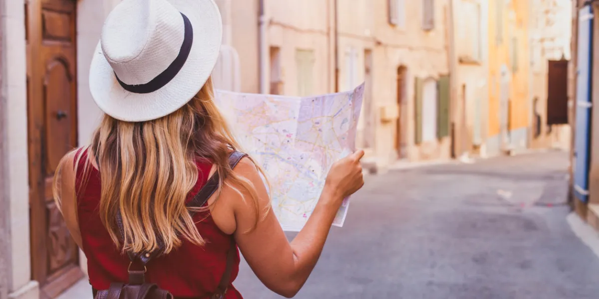 travel to europe, tourist looking at map on the street, summer holidays sightseeing tourism