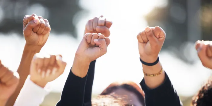 shot of a group of people protesting together in solidarity