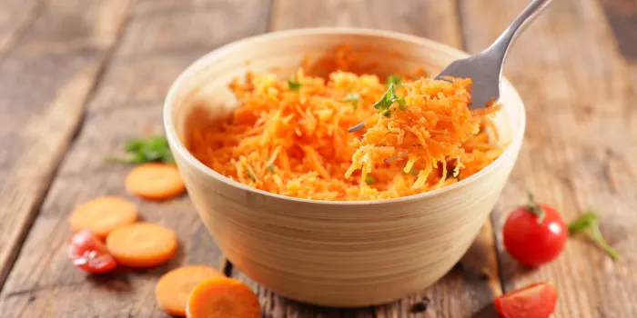 grated carrot- carrot salad and fork