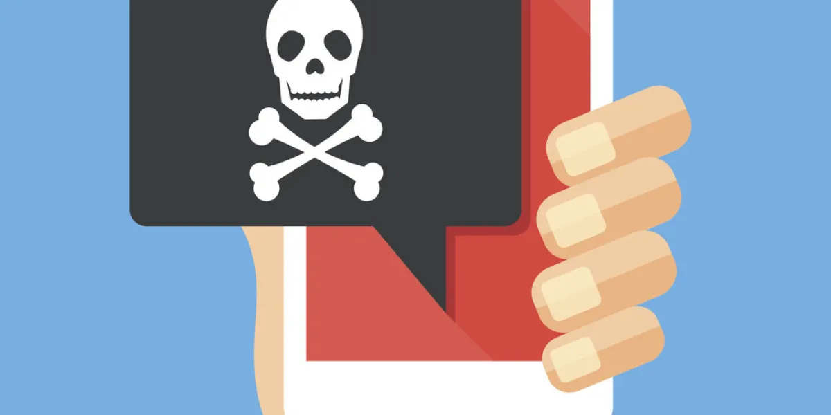 hand holding smartphone, cellphone with speech bubble and skull and bones on screen skull icon threats, mobile malware, spam messages, fraud, sms spam concepts modern flat design vector illustration