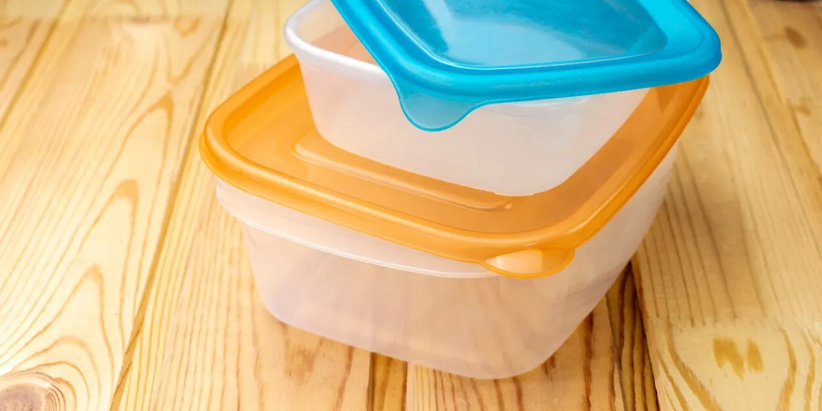 plastic food containers on a wooden table