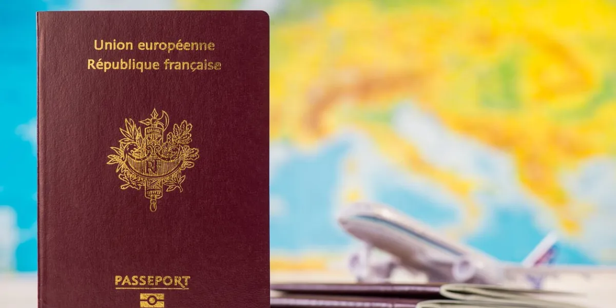 french passport on map and plane background, france
