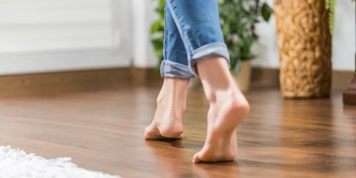 floor heating young woman walking in the house on the warm floor gently walked the wooden panels