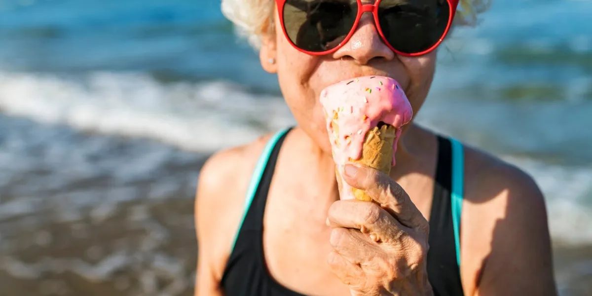 senior woman eating an ice-cream