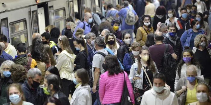 sofia, bulgaria - june 23 2020  subway train passengers with protective masks crowding to get on and off subway station platform on serdika metro station