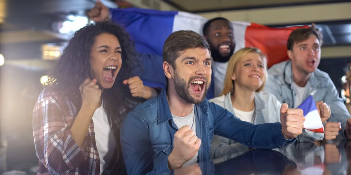 happy football fans with french flag celebrating victory in tournament, patriots