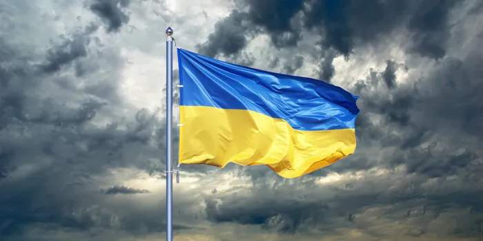 ukraine flag ukrainian flag on black storm cloud sky stormy weather
